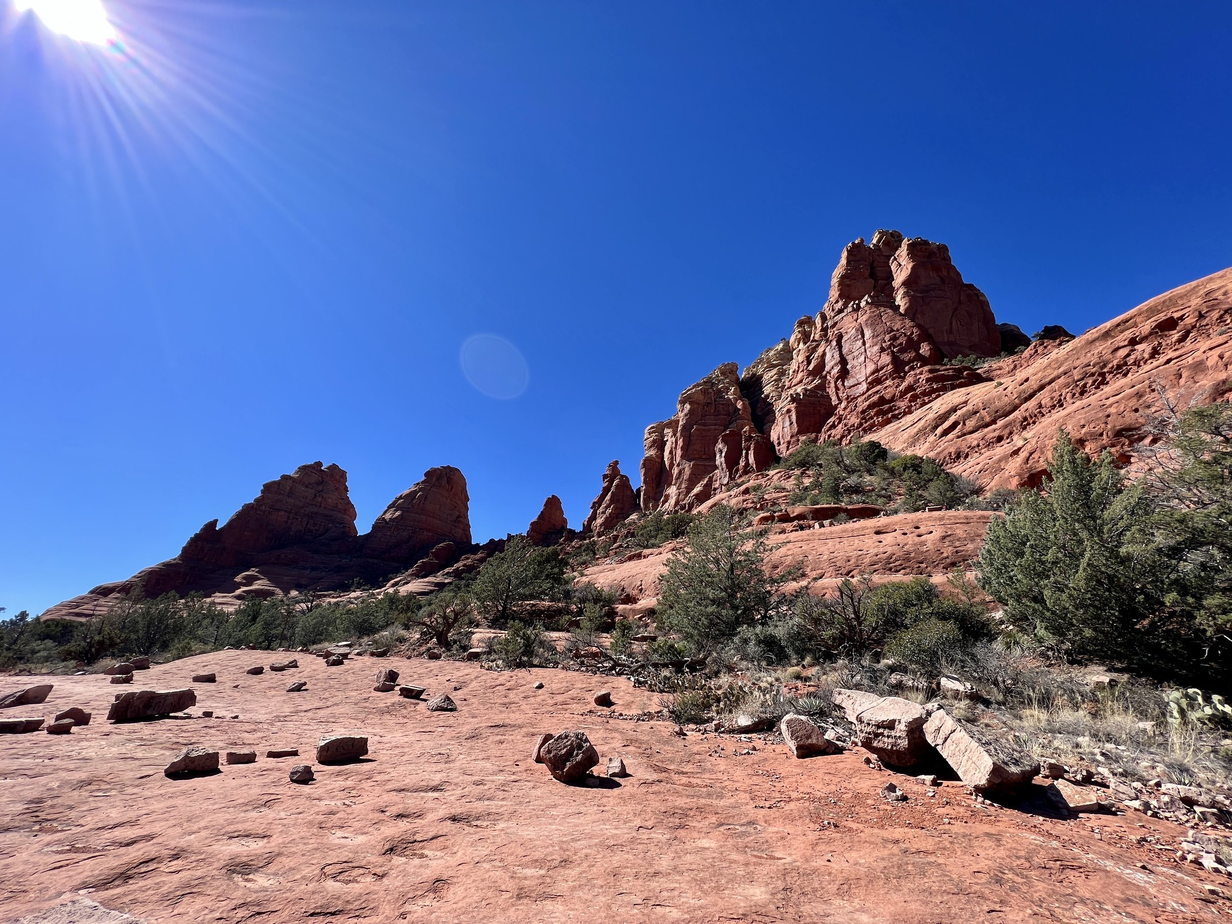 Bright sun and red rocks on the Twin Buttes Loop.